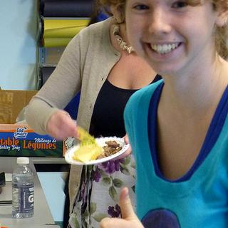 Thumbs up! Celia gives a thumbs up to the munchies provided for the ANTH Forum.