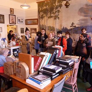 Naif, Angel, Esme, Pamela, Zak, Tamara, Kate, Usman, Mina, Yousif, Cory and Lynette. Aileen, seated, is the founder of the museum. 